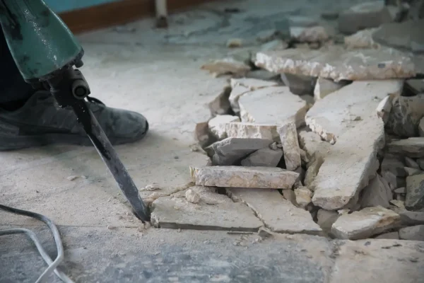 a-worker-uses-a-jackhammer-to-remove-a-layer-of-ol-2026-01-11-09-32-48-utc[1]