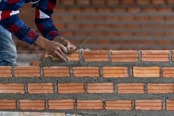 closeup-hand-professional-construction-worker-layi-2026-01-05-06-22-19-utc[1]